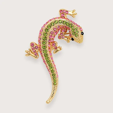 Y2K guldfarvet gekko-broche med pink rhinsten · Trendbrocher 2026 — produktfoto