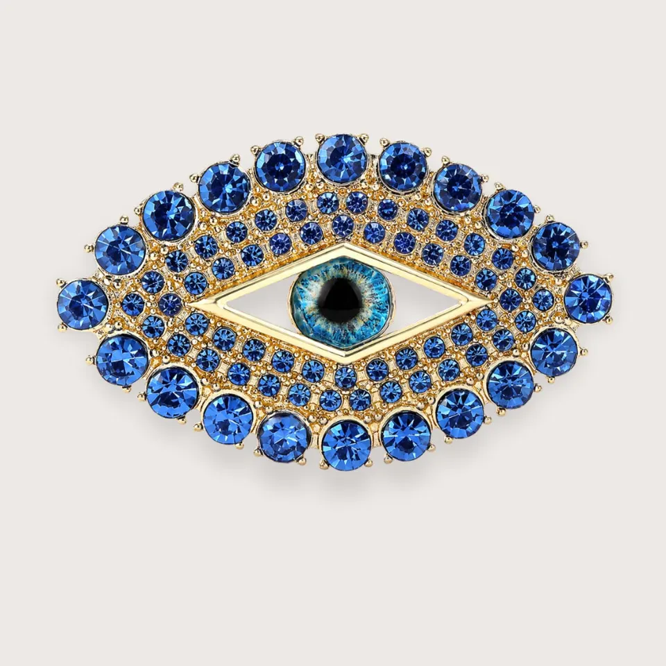 Sia øje-broche med blå rhinsten - guldfarvet broche - Chant du Matin — produktfoto